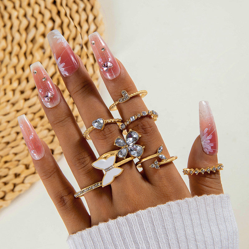 Trending Gold Plated Butterfly inspired Set of 7 Stackable Finger Rings - VAIRAVI Trending Gold Plated Butterfly inspired Set of 7 Stackable Finger Rings - VAIRAVI