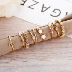 Trending Gold Plated Love inspired Set of 9 Stackable Finger Rings - VAIRAVI