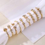 Trending Gold Plated Love inspired Set of 9 Stackable Finger Rings - VAIRAVI