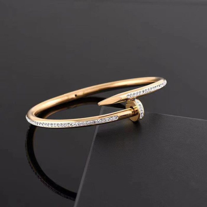 Stainless Steel Gold Plated Stainless Steel Anti Tarnish AD Studded Nail Bracelet For Women - VAIRAVI