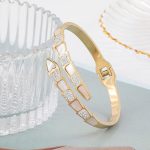 Stainless Steel Gold Plated Mother of Pearl Snake Styled AD Studded Anti-Tarnish Bracelet For Women - VAIRAVI