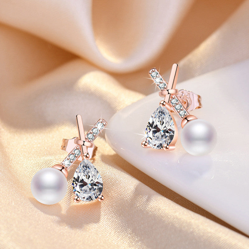 Rose Gold Plated American Diamond Studded Cross Shape Korean Stud Earrings - Image 1