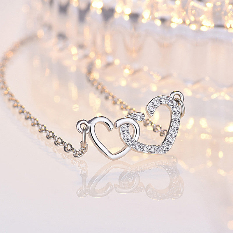 Silver Plated American Diamond Studded Dual Heart Contemporary Korean Pendant - Image 1